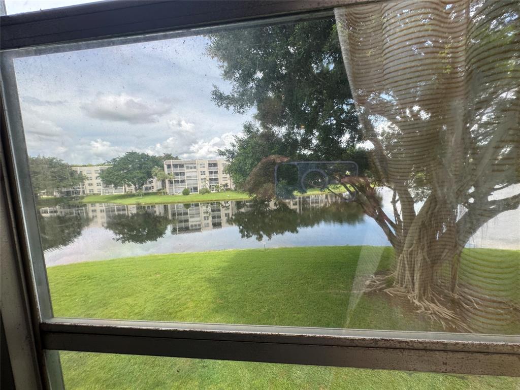 9235 A Lagoon Place, Unit 310 Davie, FL 33324 - Photo 30 of 32 a view of lake from a window