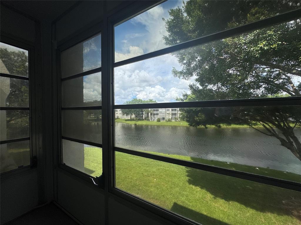 9235 A Lagoon Place, Unit 310 Davie, FL 33324 - Photo 31 of 32 a view of lake from window