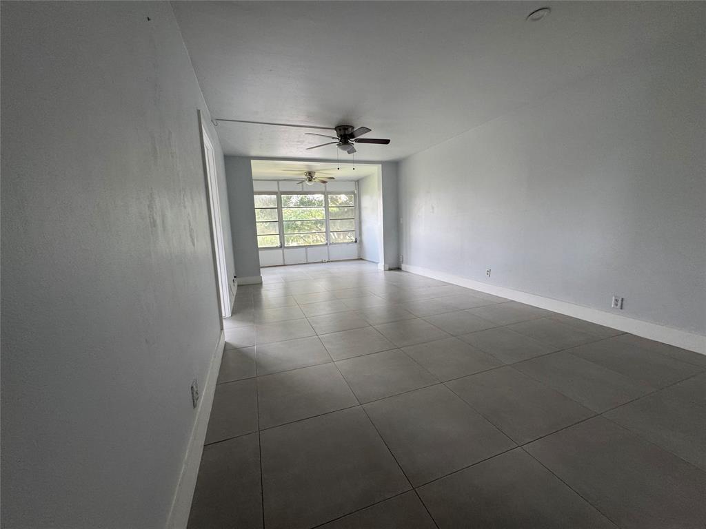 9235 A Lagoon Place, Unit 310 Davie, FL 33324 - Photo 10 of 32 a view of an empty room and window