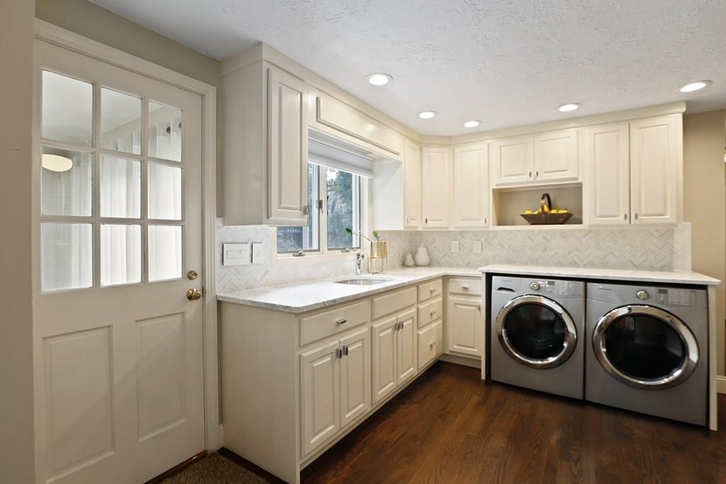 15 Herbert Road Worcester, MA 01602 - Photo 18 of 42 a kitchen with a stove a sink and a refrigerator