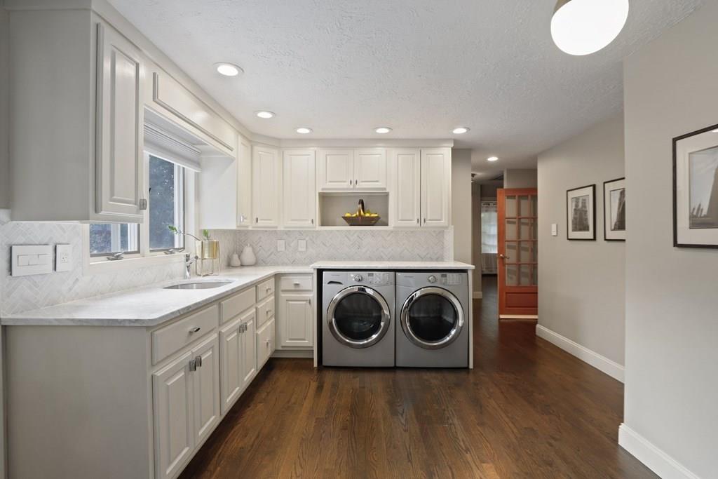 15 Herbert Road Worcester, MA 01602 - Photo 19 of 42 a kitchen with a stove top oven sink and cabinets