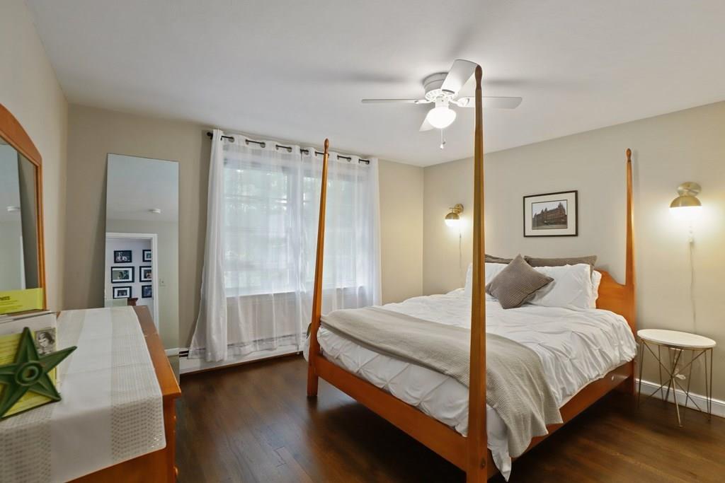 15 Herbert Road Worcester, MA 01602 - Photo 29 of 42 a bedroom with a bed and a chandelier