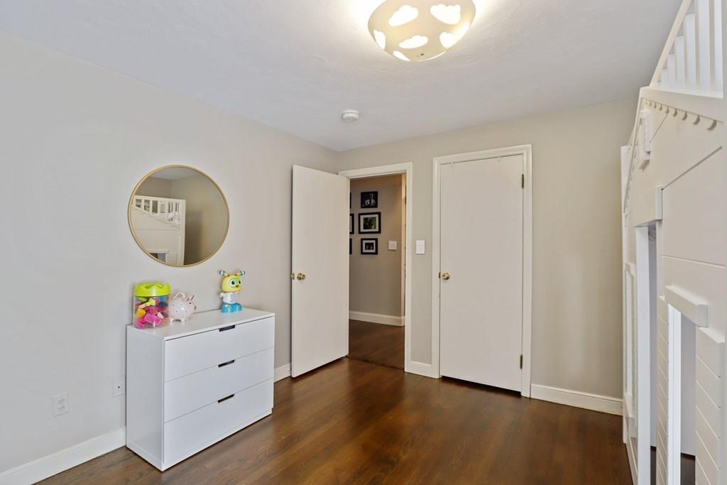 15 Herbert Road Worcester, MA 01602 - Photo 30 of 42 a view of a hallway to a livingroom with wooden floor and a window