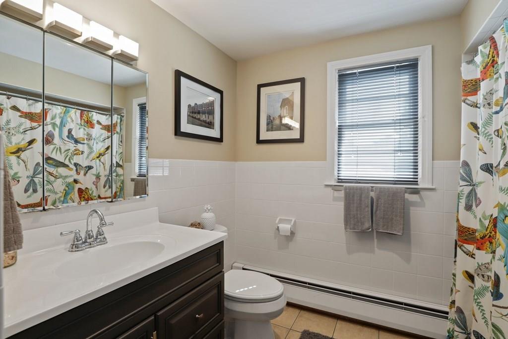 15 Herbert Road Worcester, MA 01602 - Photo 32 of 42 a bathroom with a sink a toilet a window and shower