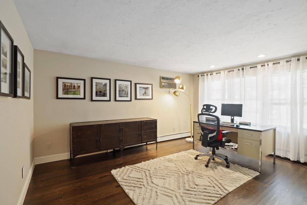 15 Herbert Road Worcester, MA 01602 - Photo 33 of 42 a view of a workspace with furniture and a bedroom