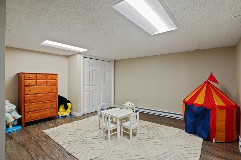 15 Herbert Road Worcester, MA 01602 - Photo 40 of 42 a workspace with furniture and wooden floor