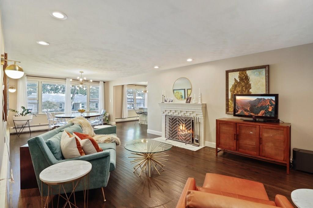 15 Herbert Road Worcester, MA 01602 - Photo 6 of 42 a living room with furniture a fireplace and a flat screen tv