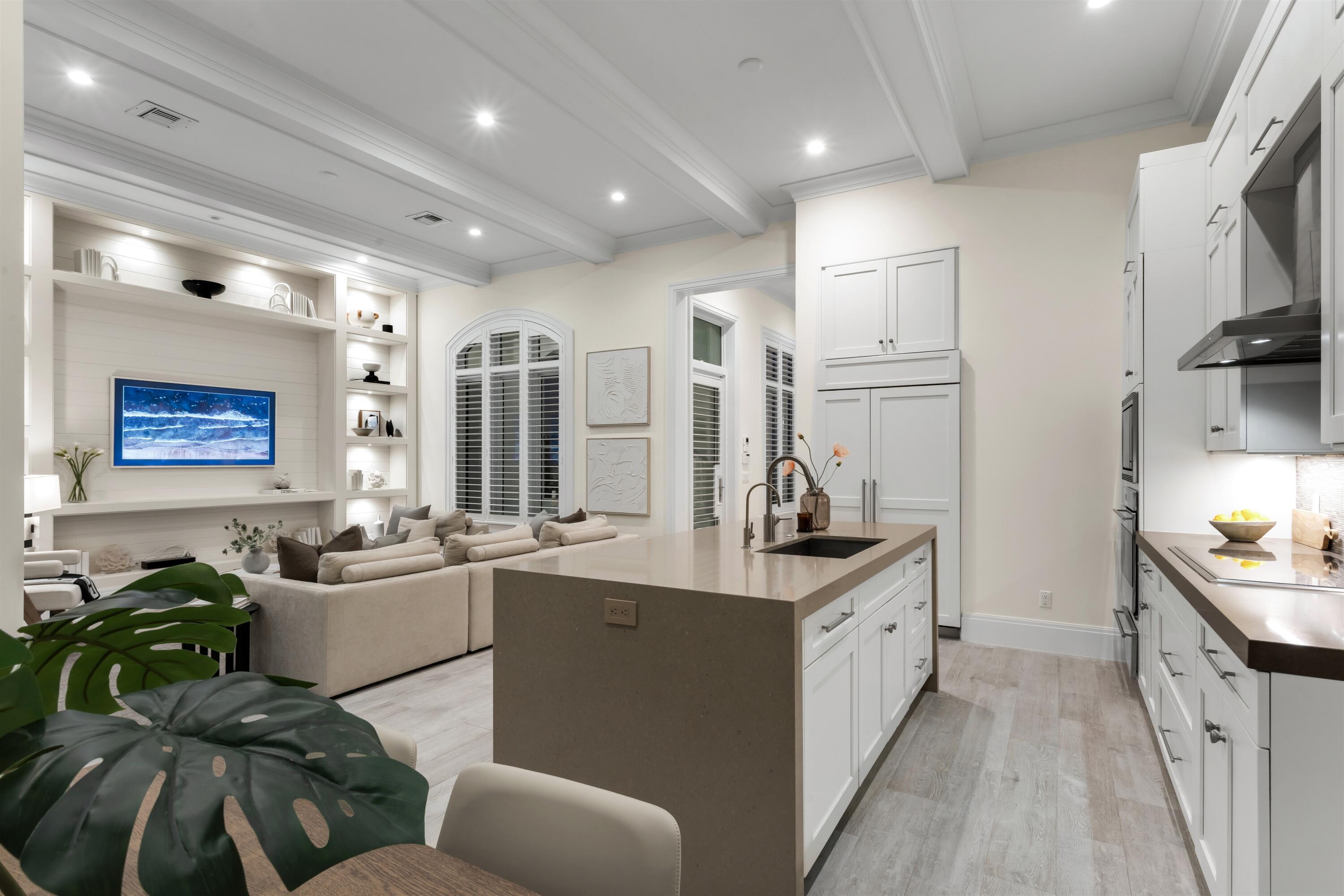 9 Adams Road Ocean Ridge, FL 33435 - Photo 11 of 40 a kitchen with counter top space a sink and appliances