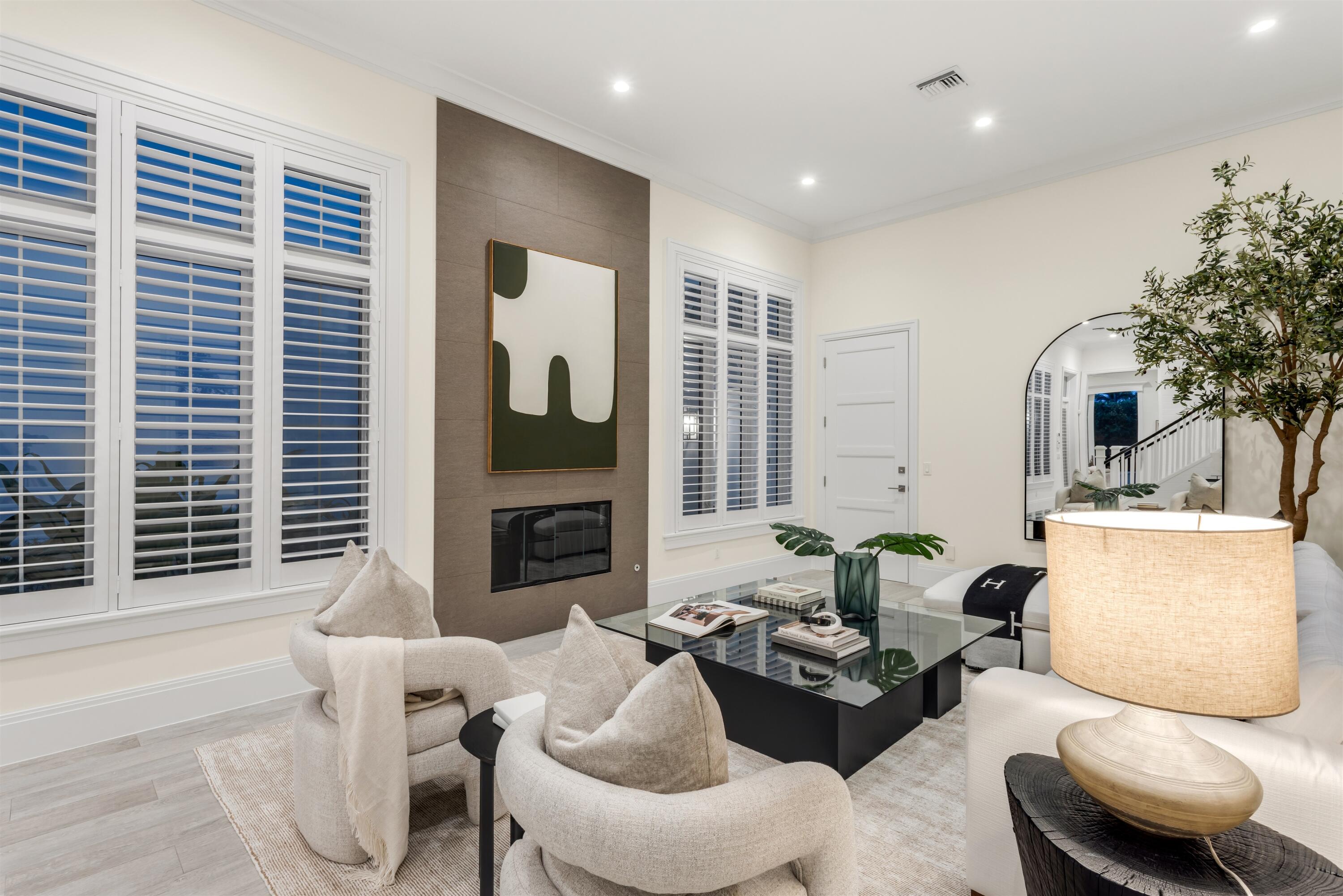 9 Adams Road Ocean Ridge, FL 33435 - Photo 17 of 40 a living room with fireplace furniture and a large window