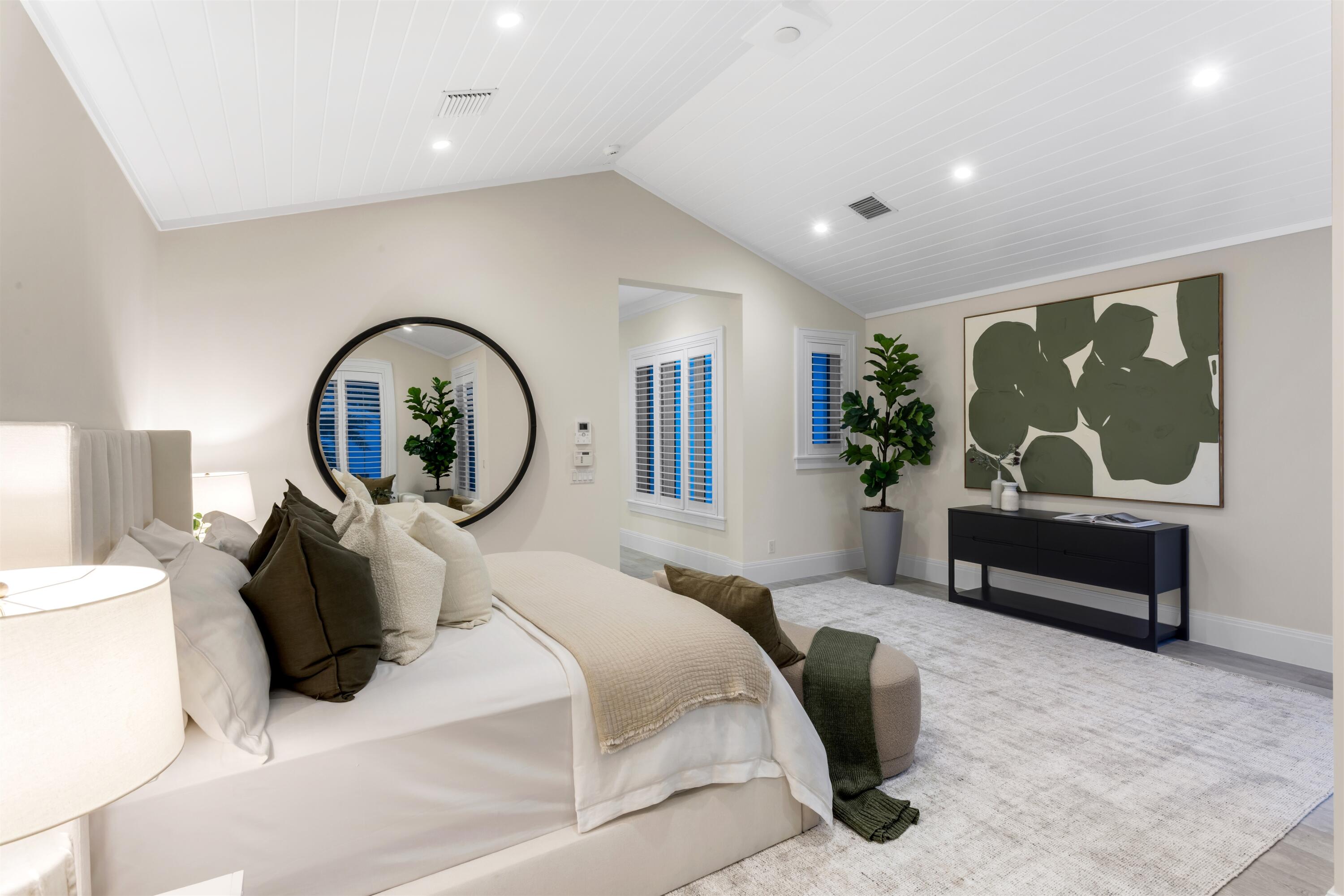 9 Adams Road Ocean Ridge, FL 33435 - Photo 21 of 40 a bedroom with a bed and a mirror