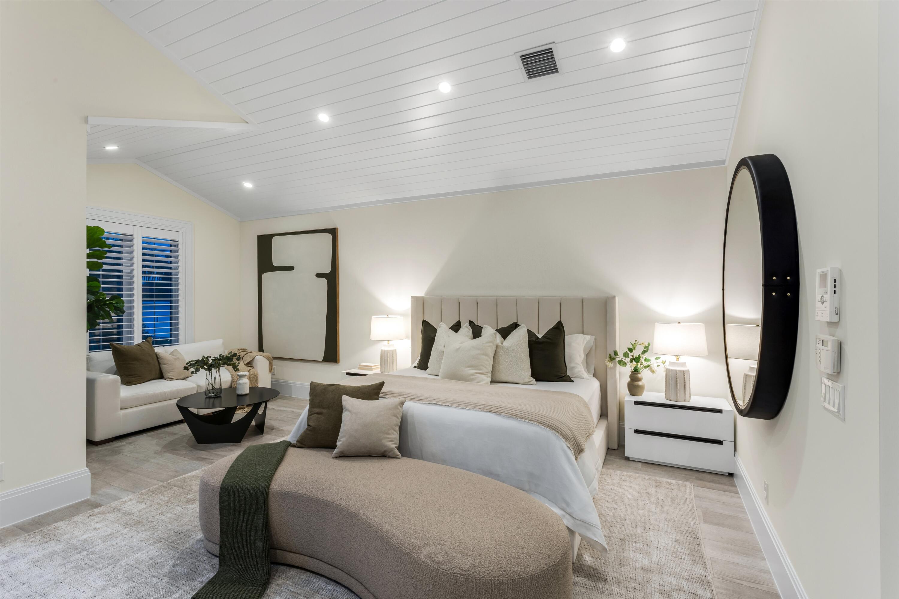 9 Adams Road Ocean Ridge, FL 33435 - Photo 22 of 40 a bedroom with a large bed and a large window