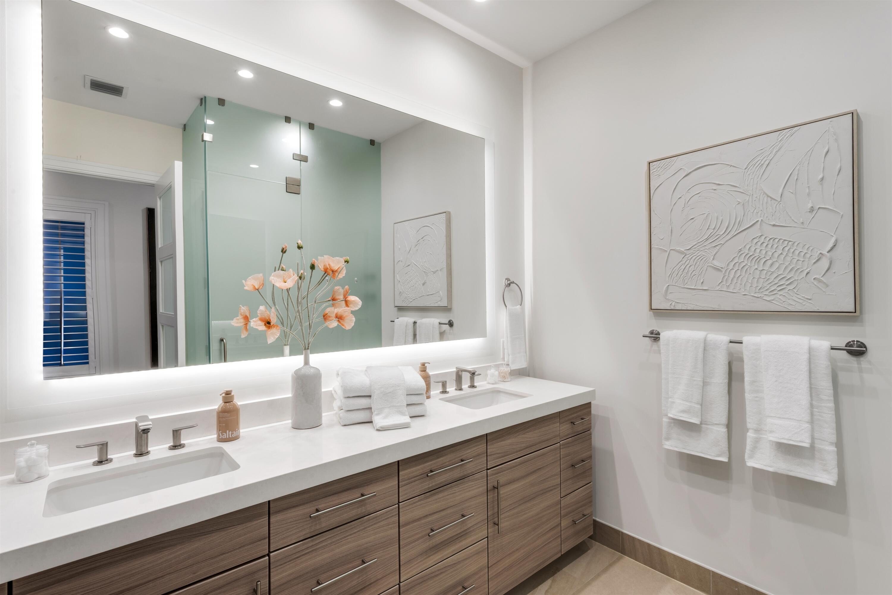 9 Adams Road Ocean Ridge, FL 33435 - Photo 27 of 40 a bathroom with a double vanity sink and a mirror