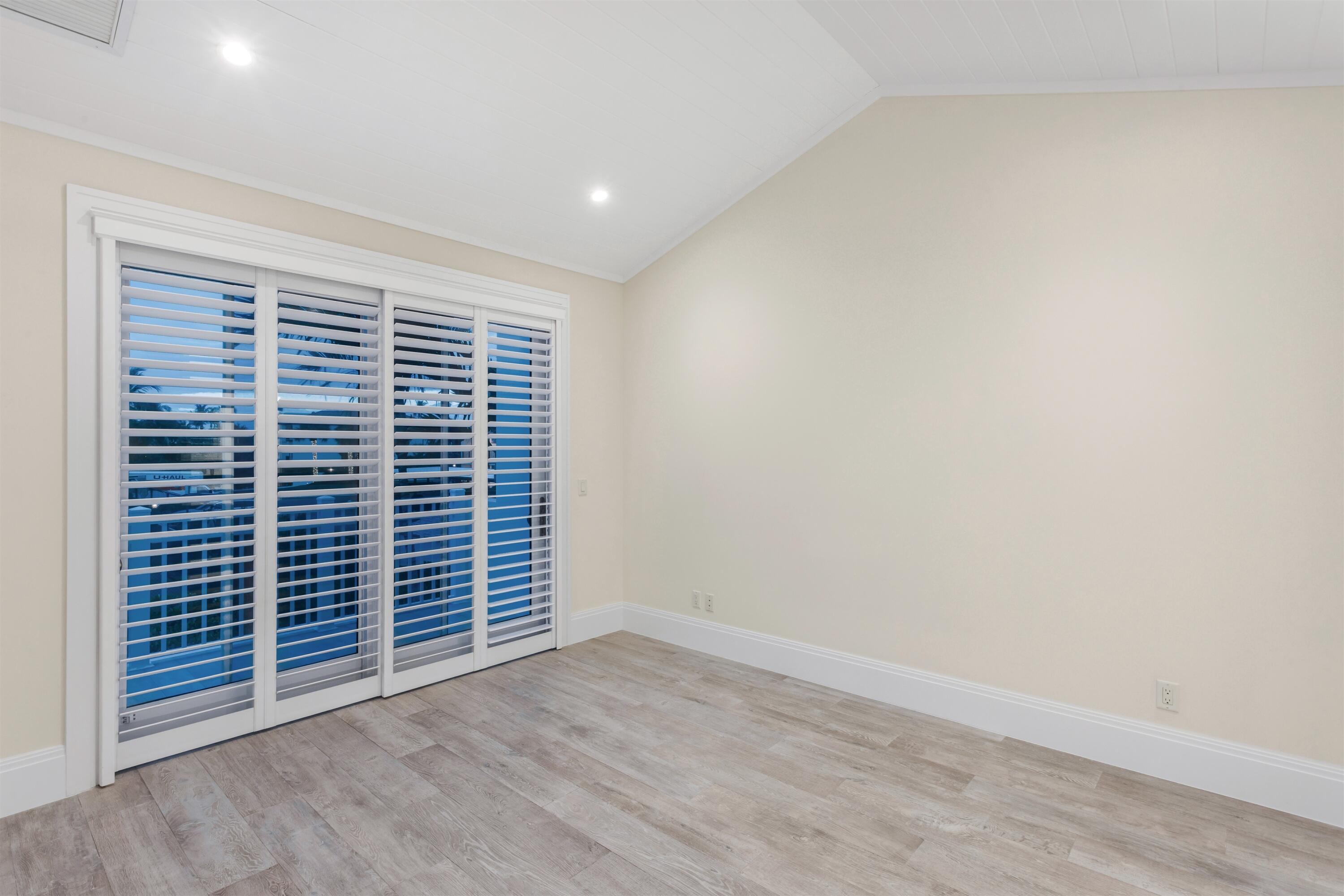 9 Adams Road Ocean Ridge, FL 33435 - Photo 28 of 40 a view of empty room with wooden floor and fan