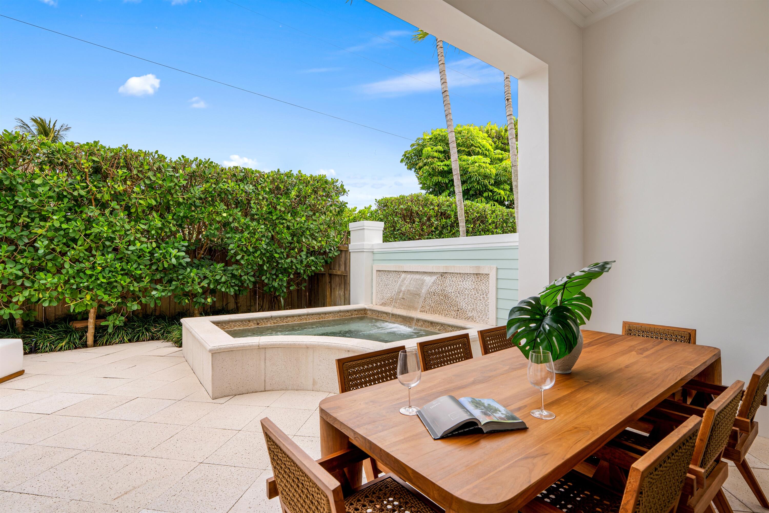 9 Adams Road Ocean Ridge, FL 33435 - Photo 33 of 40 a outdoor dining space with furniture and potted plants