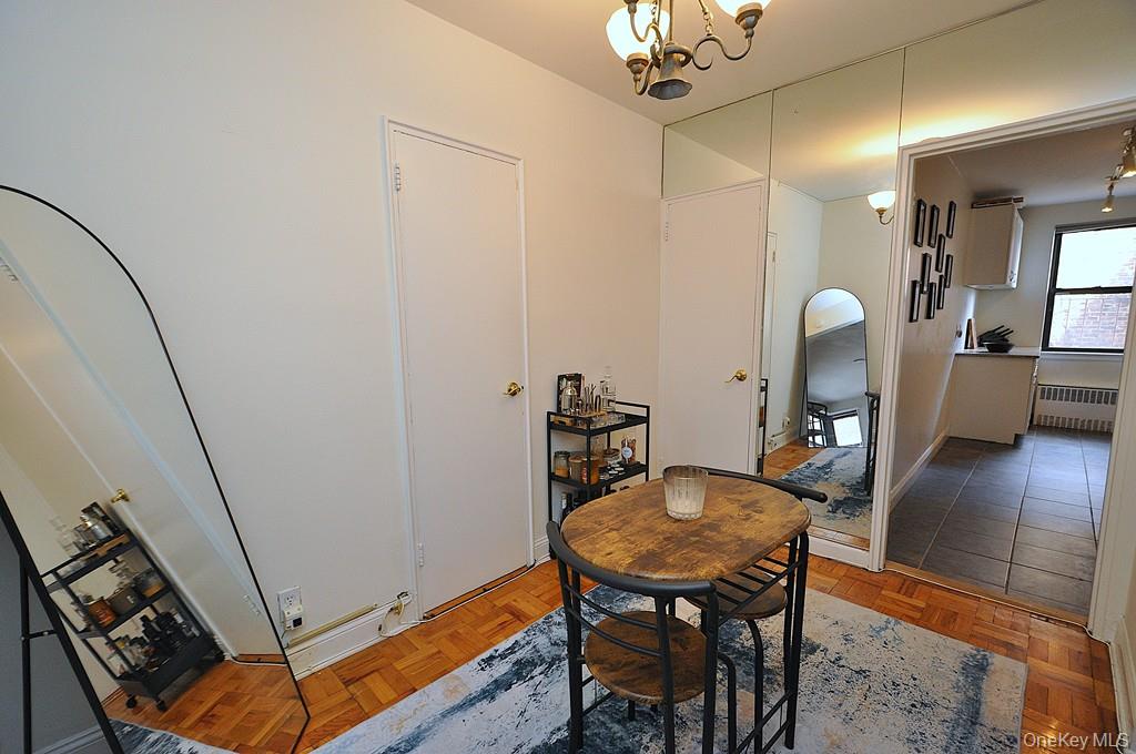 142 Garth Road, Unit 1A Scarsdale, NY 10583 - Photo 17 of 34 a view of a dining room with furniture and wooden floor