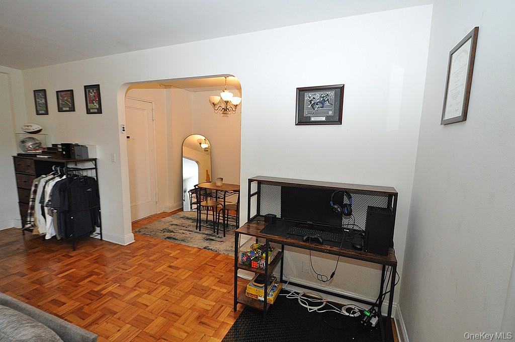 142 Garth Road, Unit 1A Scarsdale, NY 10583 - Photo 21 of 34 a room with furniture and a flat screen tv