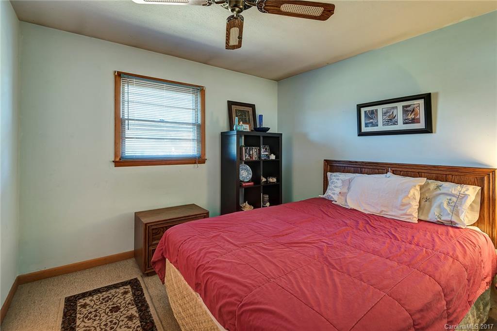 641 Newfound Road Leicester, NC 28748 - Photo 11 of 23 a bedroom with a large bed and a window