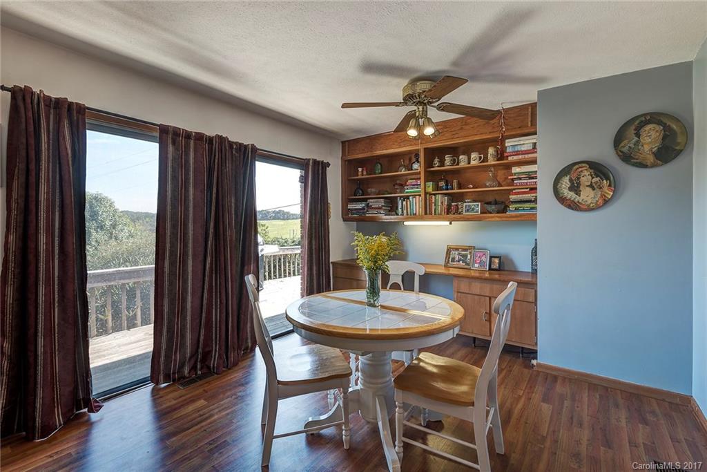 641 Newfound Road Leicester, NC 28748 - Photo 7 of 23 a view of a dining room with furniture window and wooden floor
