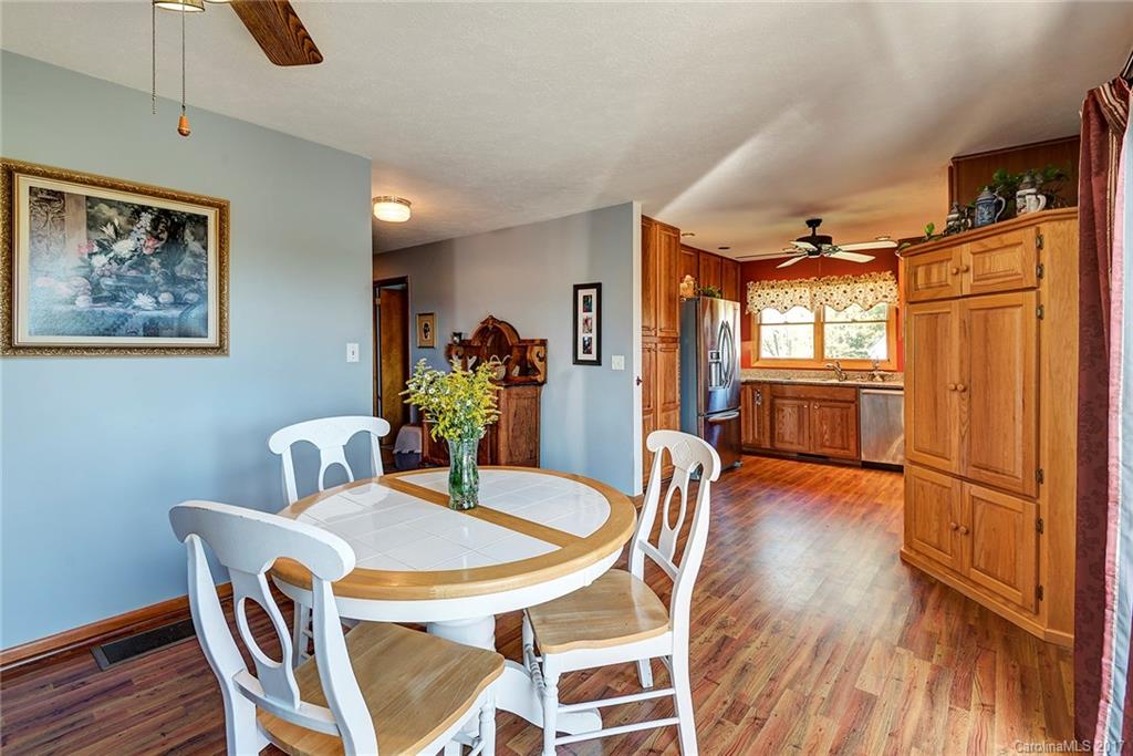 641 Newfound Road Leicester, NC 28748 - Photo 9 of 23 a view of a dining room with furniture window and wooden floor
