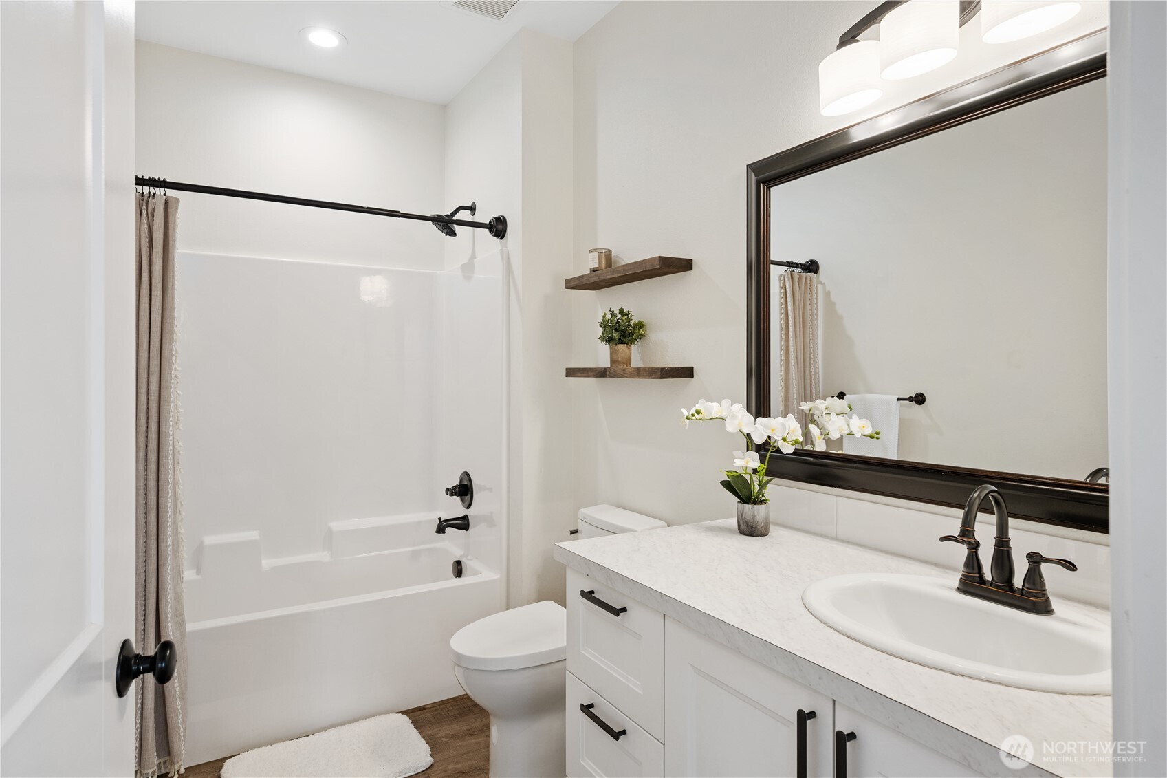 2617 Byrnes Road Touchet, WA 99360 - Photo 18 of 40 a bathroom with a bathtub shower sink vanity mirror and toilet