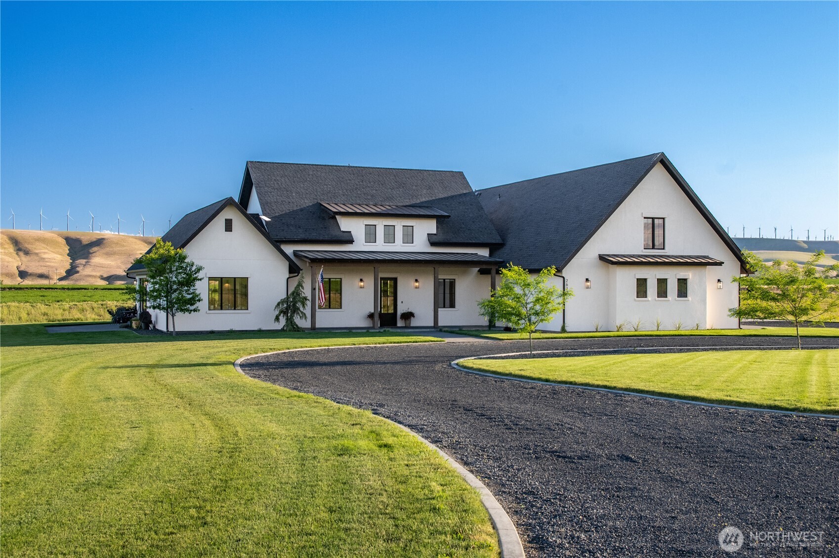 2617 Byrnes Road Touchet, WA 99360 - Photo 2 of 40 a front view of a house with swimming pool having outdoor seating