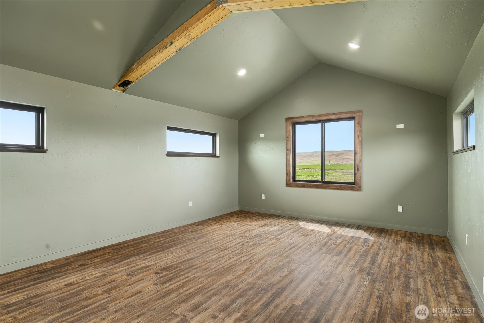 2617 Byrnes Road Touchet, WA 99360 - Photo 32 of 40 an empty room with wooden floor and windows