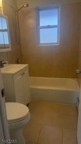 a bathroom with a sink a toilet and bathtub