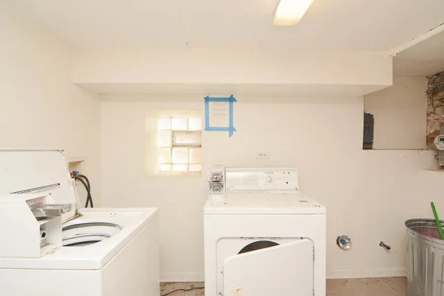 a utility room with a sink dryer and washer