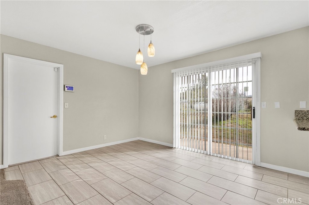4875 Sunnyslope Road Phelan, CA 92371 - Photo 16 of 57 a view of an empty room with a window
