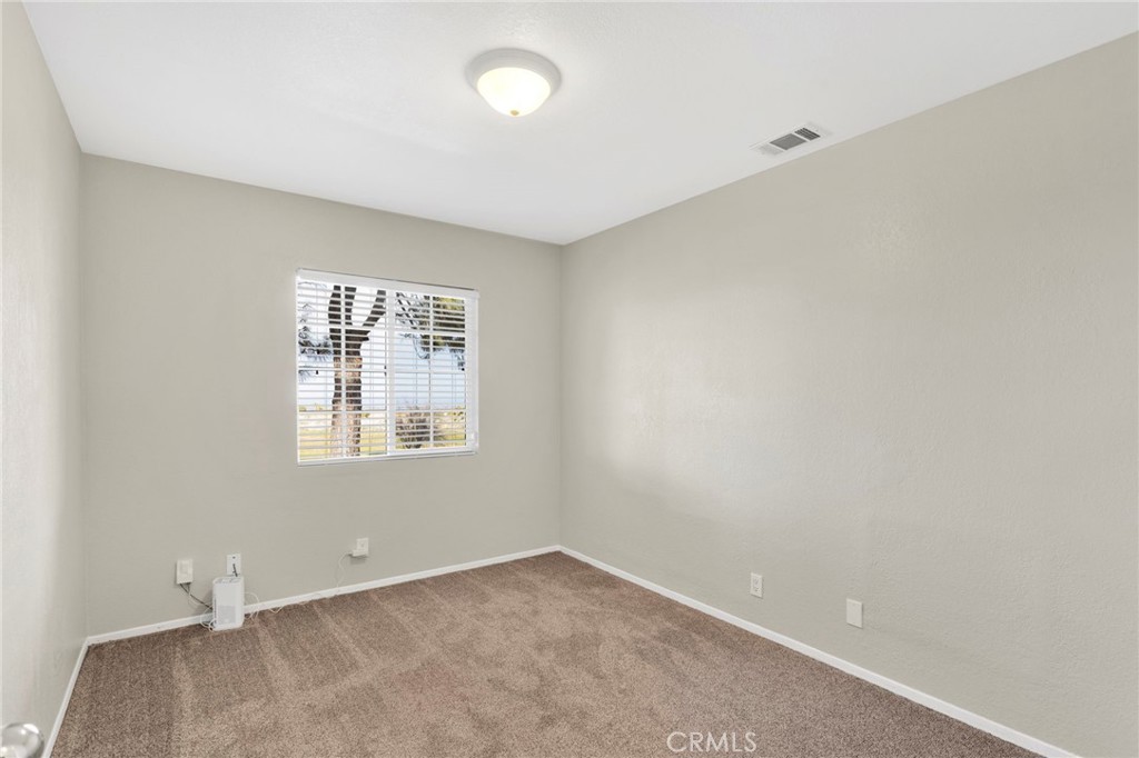 4875 Sunnyslope Road Phelan, CA 92371 - Photo 22 of 57 an empty room with a window