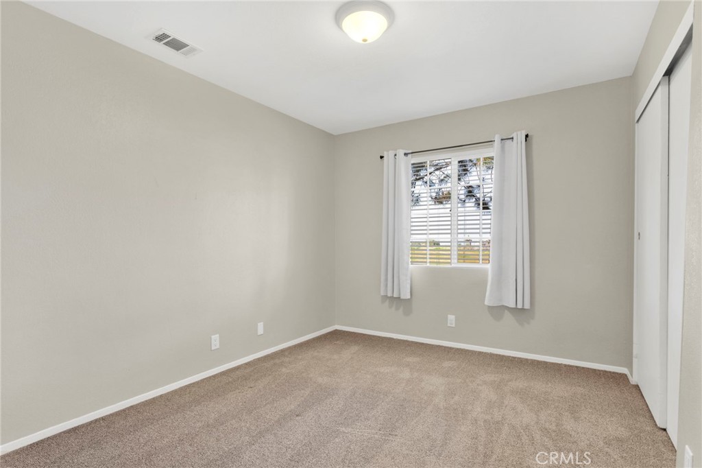 4875 Sunnyslope Road Phelan, CA 92371 - Photo 22 of 57 a view of an empty room with a window