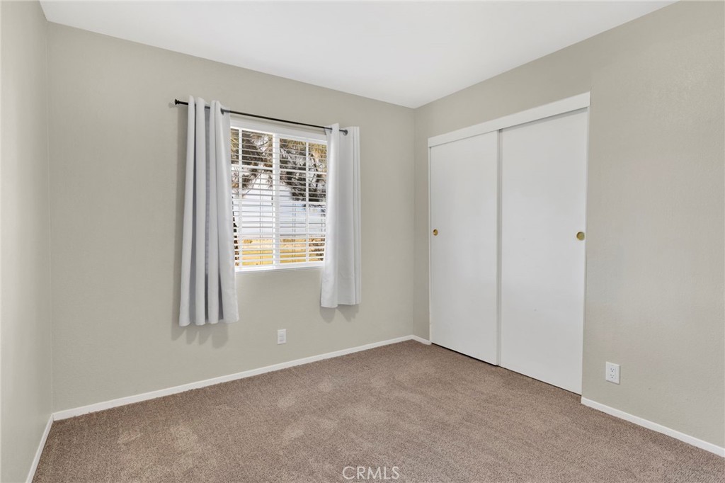 4875 Sunnyslope Road Phelan, CA 92371 - Photo 23 of 57 a view of an empty room with a window