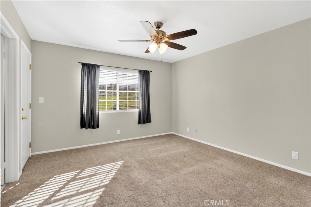 4875 Sunnyslope Road Phelan, CA 92371 - Photo 24 of 57 a view of an empty room with a window
