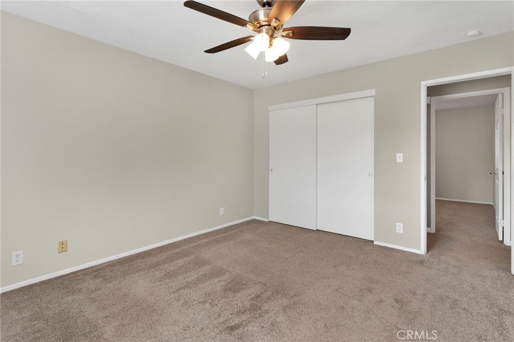 4875 Sunnyslope Road Phelan, CA 92371 - Photo 30 of 57 a view of an empty room and chandelier fan