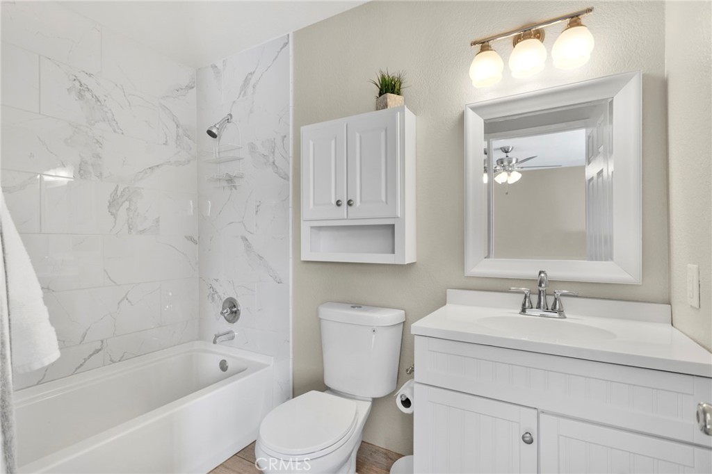 4875 Sunnyslope Road Phelan, CA 92371 - Photo 32 of 57 a bathroom with a sink a toilet and shower