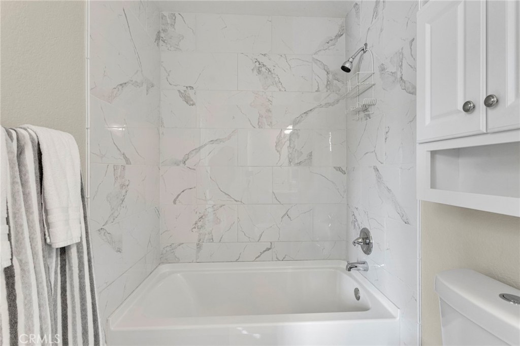 4875 Sunnyslope Road Phelan, CA 92371 - Photo 33 of 57 a bath tub sitting next to a white sink and vanity