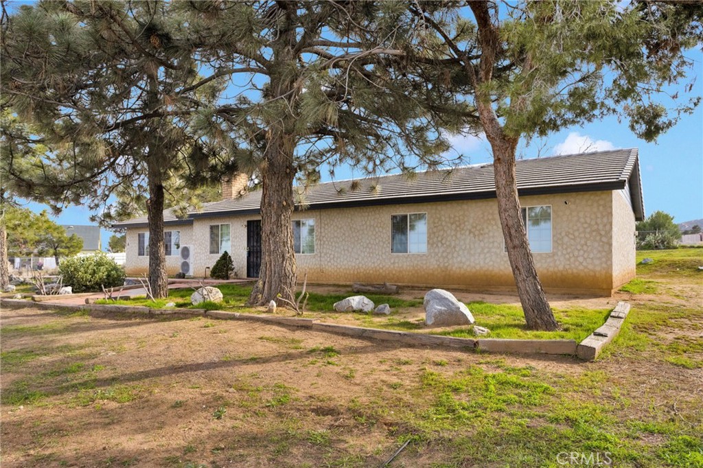 4875 Sunnyslope Road Phelan, CA 92371 - Photo 35 of 57 a front view of a house with garden
