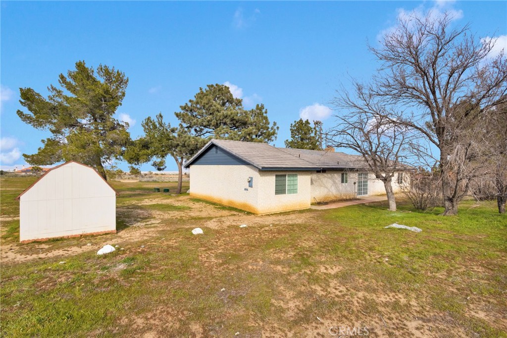 4875 Sunnyslope Road Phelan, CA 92371 - Photo 38 of 57 a view of a house with a yard