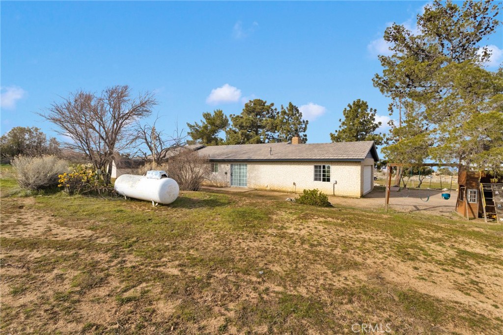 4875 Sunnyslope Road Phelan, CA 92371 - Photo 41 of 57 a view of a house with a yard