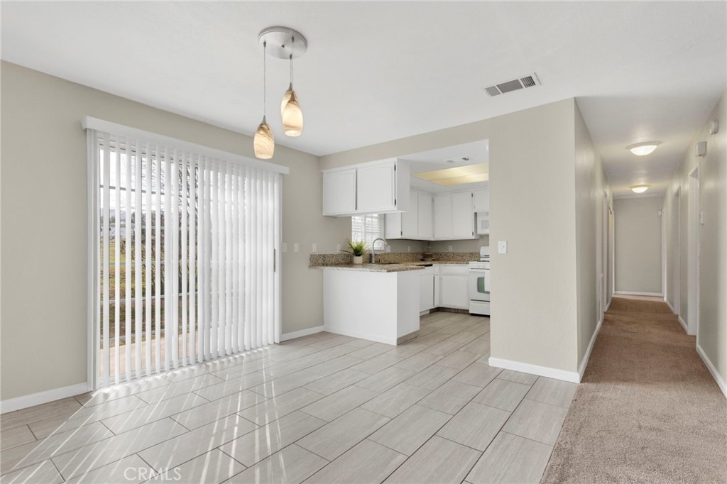 4875 Sunnyslope Road Phelan, CA 92371 - Photo 9 of 57 a view of kitchen with granite countertop cabinets and window
