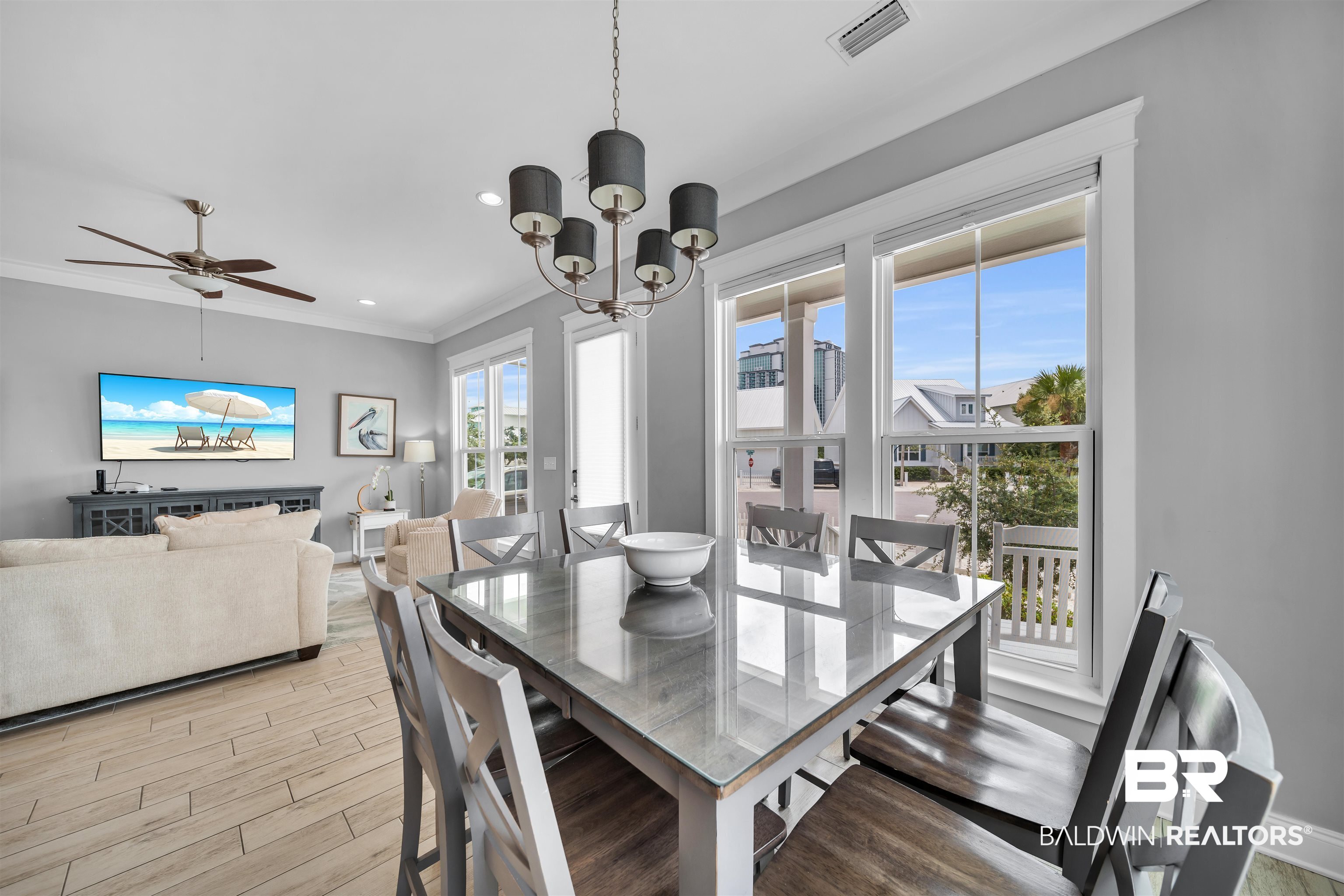 47 Parks Edge Orange Beach, AL 36561 - Photo 4 of 40 Dining area with light wood-style floors, crown molding, a chandelier, recessed lighting, and ceiling fan