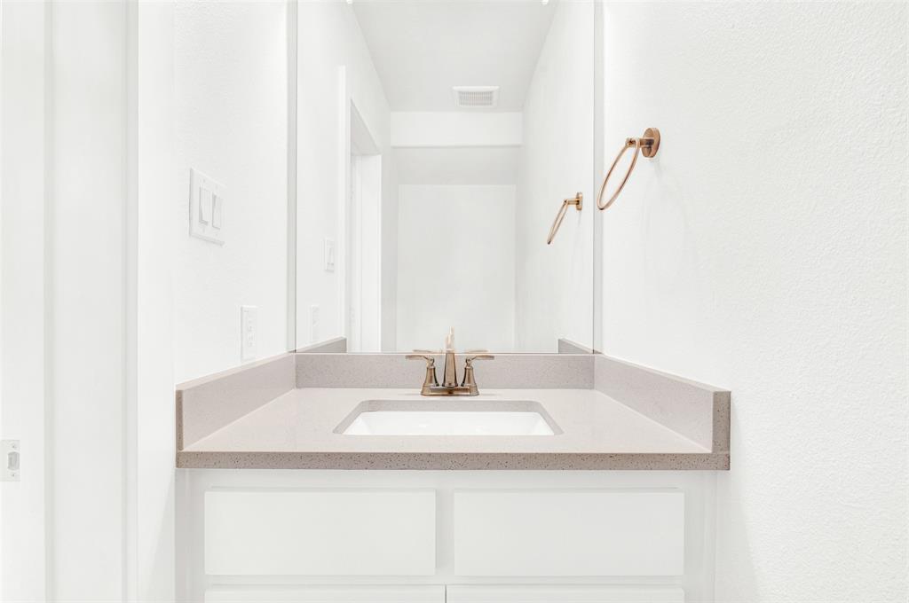 3676 Rickshaw Drive, Unit C Dallas, TX 75229 - Photo 11 of 22 Downstairs custom half bath with above vanity.