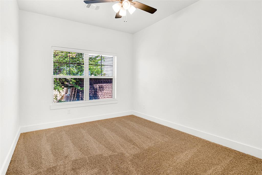 3676 Rickshaw Drive, Unit C Dallas, TX 75229 - Photo 14 of 22 Spacious upstairs bedroom with ample natural light.
