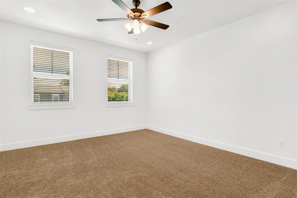 3676 Rickshaw Drive, Unit C Dallas, TX 75229 - Photo 17 of 22 Another view of upstairs secondary bedroom with lots of natural light.