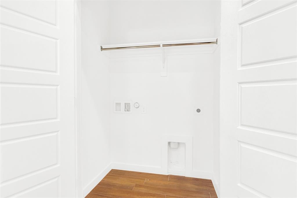 3676 Rickshaw Drive, Unit C Dallas, TX 75229 - Photo 22 of 22 Adjacent to the kitchen area is standard washer and dryer sized laundry room.