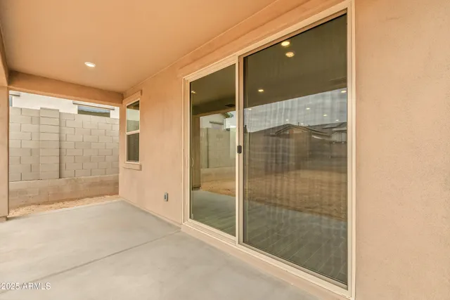 a backyard of a house with wooden fence