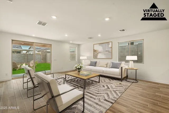 a living room with furniture and a table