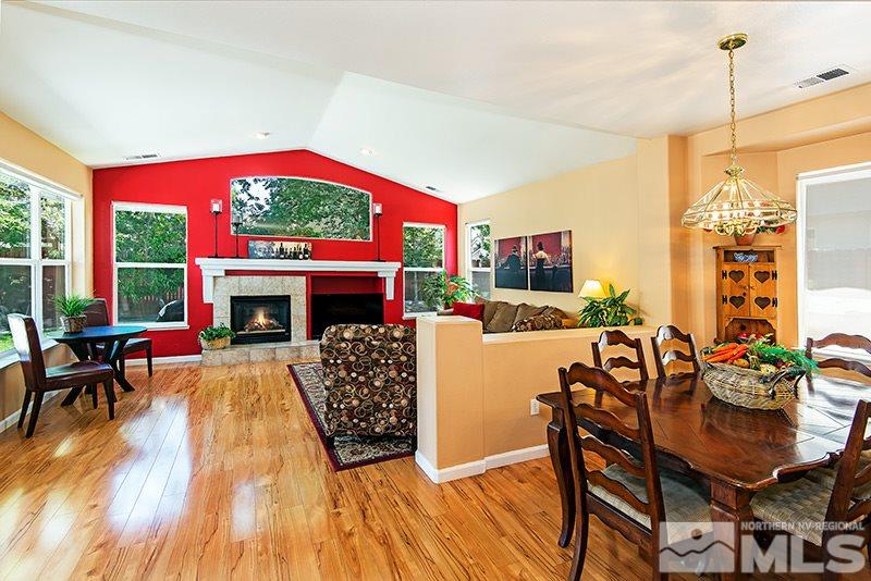 9628 Rolling Rock Way Reno, NV 89521 - Photo 13 of 23 a living room with furniture a window and a fireplace