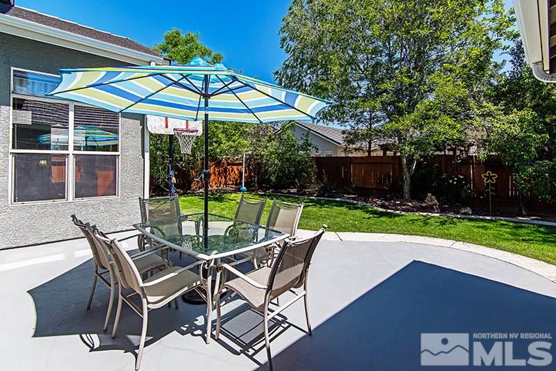 9628 Rolling Rock Way Reno, NV 89521 - Photo 21 of 23 a patio with a yard table and chairs