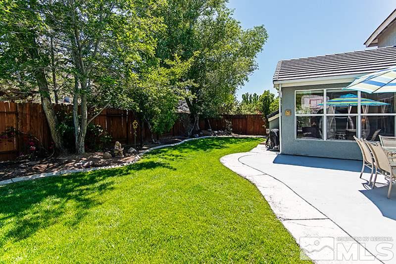 9628 Rolling Rock Way Reno, NV 89521 - Photo 23 of 23 a view of an house with backyard space and porch